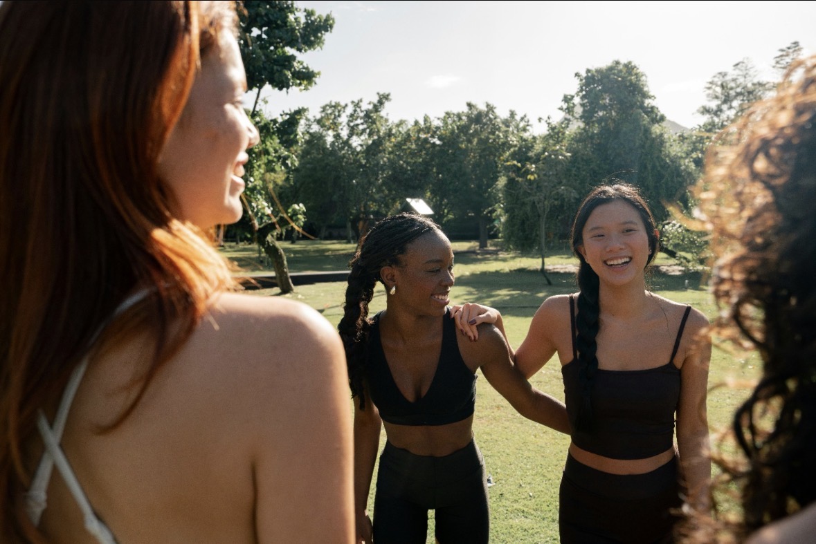 Friends laughing together in a park